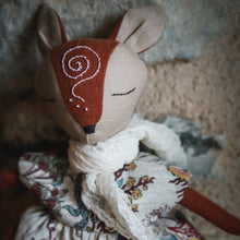 Charger l'image dans la galerie, Close-up of a handmade linen fox spirit guardian doll wearing an elegant floral printed dress, a muslin scarf, and featuring a hand-embroidered whimsical spiral on her forehead